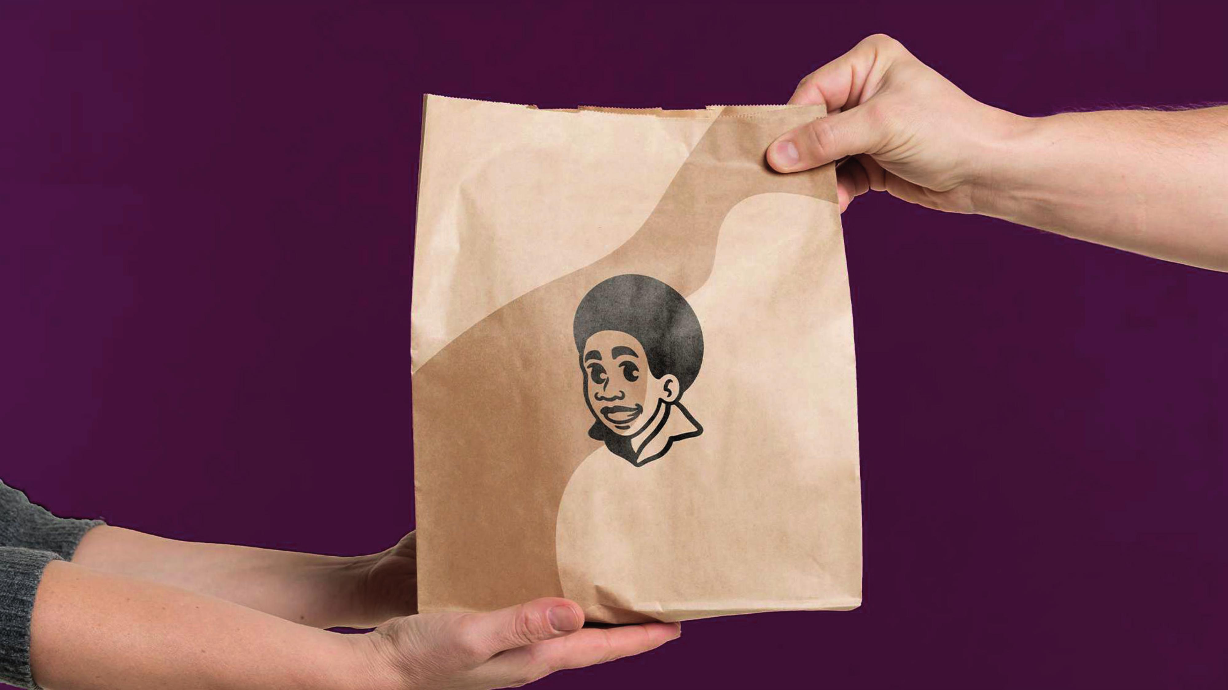 Soul Burguer — branded paper bag handoff
